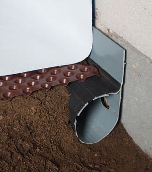 Closeup of a crawl space drainage system installed in Reidsville