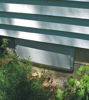 A gray crawl space vent cover in Sylvania