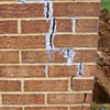 Tuckpointing that cracked due to foundation settlement of a Macon home
