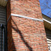 A tilting chimney on a Bloomingdale home with a leaning, tilting chimney that was temporarily repaired.