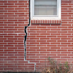 A foundation with a large crack that's wider at the top than on the bottom in Reidsville