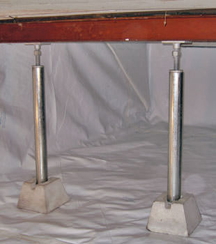 Crawl space jack posts installed in conjunction with a crawl space vapor barrier in Reidsville