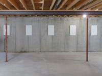 A repaired basement wall with foundation wall anchor covers installed in Walterboro.