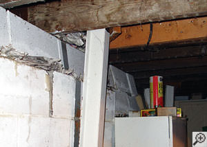 A failing foundation wall and i-beam support in a Savannah home
