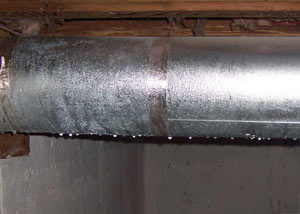 condensation collecting on an HVAC vent in a humid Kingsland basement