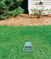 A buried gutter drain downspout extension installed in a Metter home